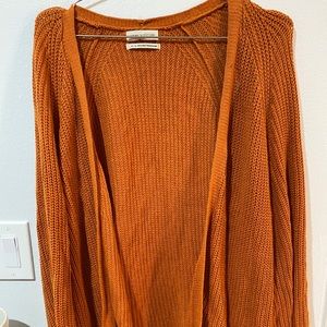 Long, oversized cardigan.